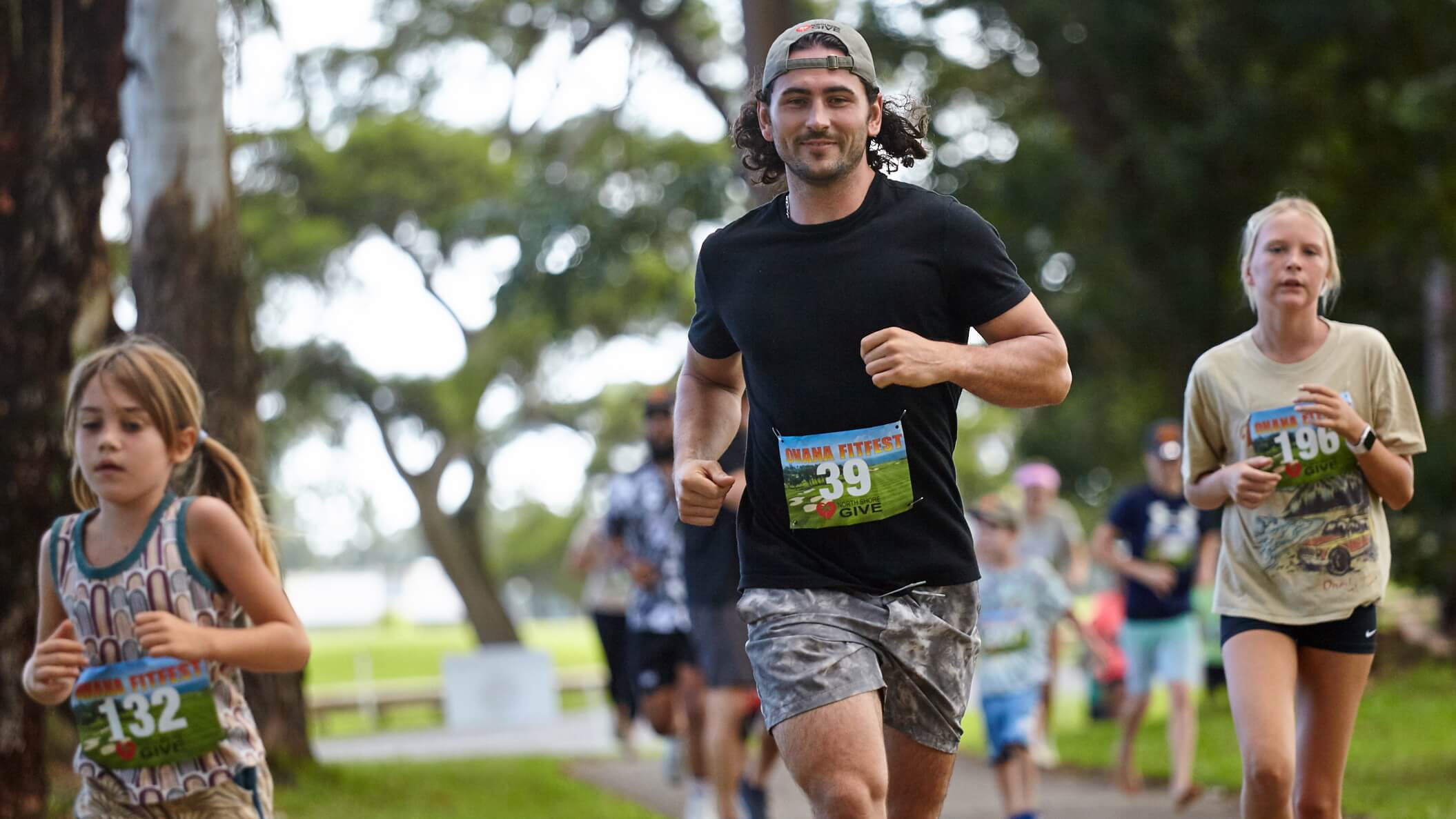 People running in a park race event