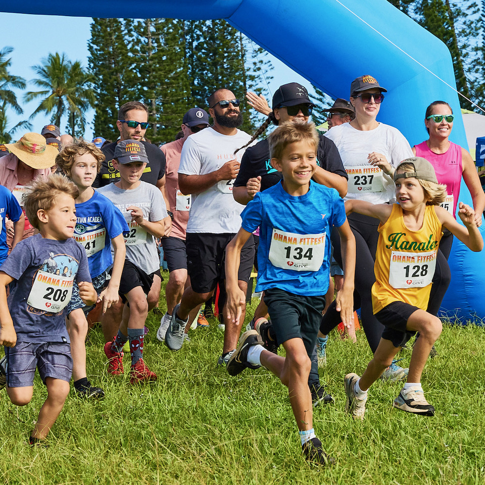 Children and adults start an outdoor charity race